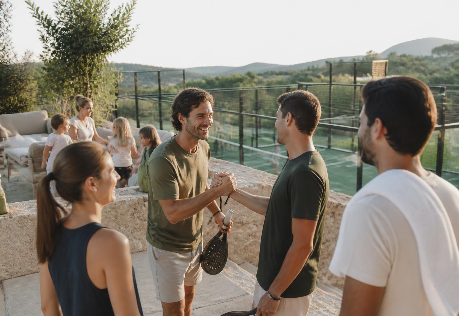 Verlin Society members greeting each other at a private gathering